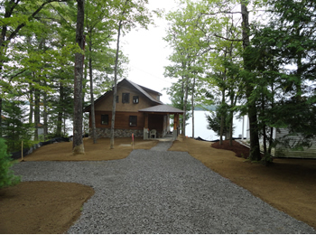 Custom driveway and landscaping by Rossignol's Excavating.